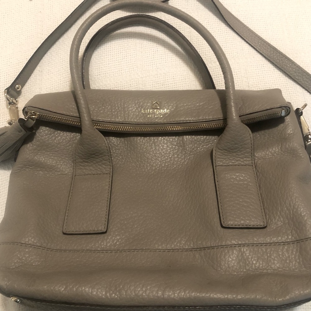 Kate Spade Taupe Leather lined openings w/ both hand & shoulder straps & feet.